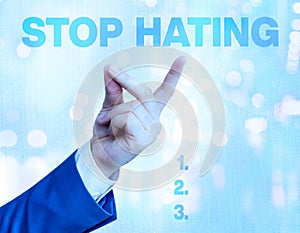 Writing note showing Stop Hating. Business photo showcasing to drop all standards and wholeheartedly agree without question photo