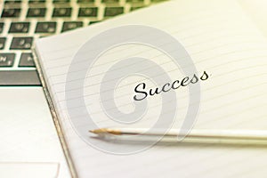Writing note showing Success. Inspirational motivating quote on notebook