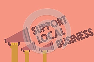 Writing note showing Support Local Business. Business photo showcasing increase investment in your country or town Hands holding m