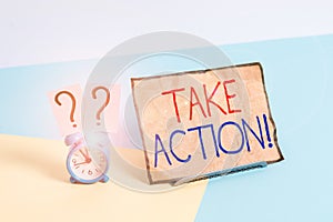 Writing note showing Take Action. Business photo showcasing do something official or concerted to achieve aim with problem Alarm