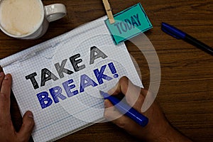 Writing note showing Take A Break. Business photo showcasing Resting Stop doing something recreation time get out of work Hand hol