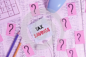 Writing note showing Tax Savings. Business photo showcasing only a portion of income is taxable Pay a reduced amount of