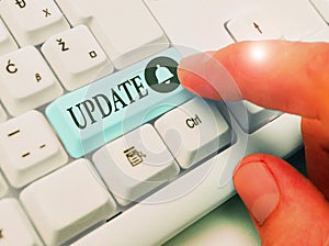 Writing note showing Update. Business photo showcasing make something more modern or up to date like software programs