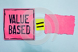 Writing note showing Value Based. Business photo showcasing Considering the product worth in satisfying the customer Pink paper no