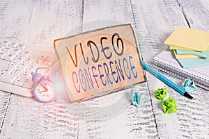 Writing note showing Video Conference. Business photo showcasing showing in remote places hold facetoface meetings Notepaper on