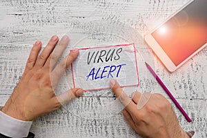 Writing note showing Virus Alert. Business photo showcasing message warning of a nonexistent computer virus threat Hand