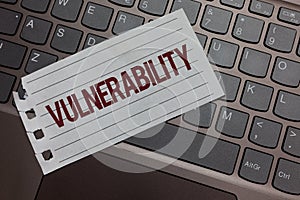 Writing note showing Vulnerability. Business photo showcasing Information susceptibility systems bug exploitation attacker Keyboar