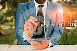 Writing note showing Warning Nosebleed. Business photo showcasing caution on bleeding from the blood vessels in the nose