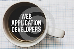 Writing note showing Web Application Developers. Business photo showcasing Internet programming experts Technology software Coffee