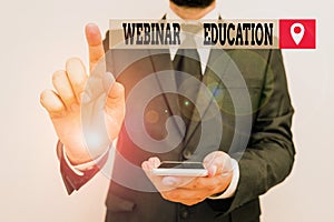 Writing note showing Webinar Education. Business photo showcasing online meeting or presentation held via the Internet
