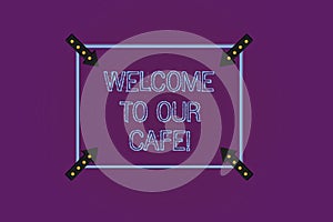 Writing note showing Welcome To Our Cafe. Business photo showcasing Greeting receiving showing in restaurant good