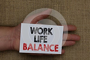 Writing note showing Work Life Balance. Business photo showcasing Division of time between working or family and leisure Human han