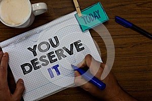 Writing note showing You Deserve It. Business photo showcasing Reward for something well done Deserve Recognition award Hand hold