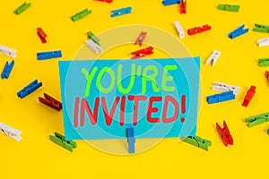 Writing note showing You Re Invited. Business photo showcasing make a polite friendly request to someone go somewhere Colored photo
