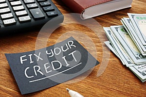 Writing note shows the text Fix your credit