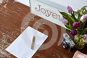 Writing in notebook tulips and camera decoration