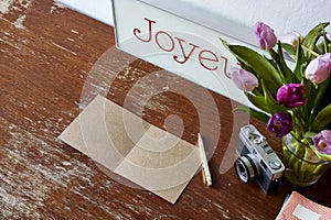 Writing in notebook tulips and camera decoration