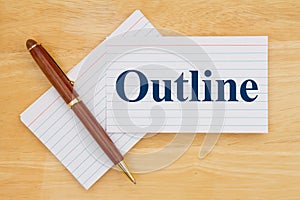Writing an outline message with retro white paper index cards with pen