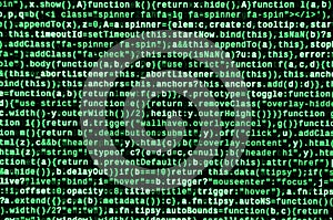 Writing programming code on laptop. Digital binary data on computer screen