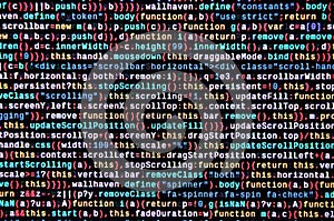 Writing programming code on laptop. Digital binary data on computer screen