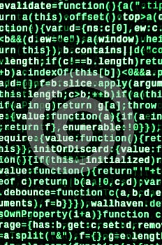 Writing programming code on laptop. Digital binary data on computer screen