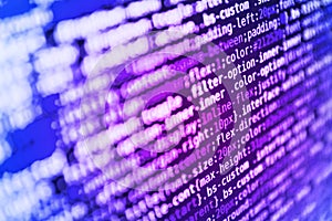 Writing programming functions on laptop. Blurred screen with selective focus. Abstract computer script source code. WWW software