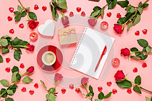 Writing prompts for Valentine`s day. Flat lay with red roses, coffee cup, present, hearts and blank notebook on pink background.