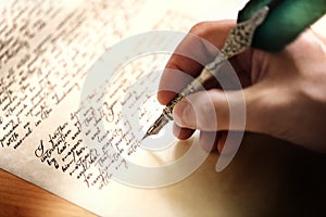 Writing with quill pen photo