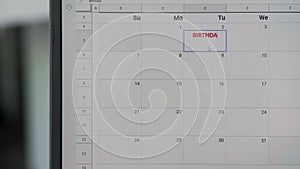 Writing red BIRTHDAY on 2th on calendar to remember this date.