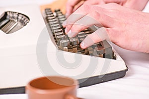 Writing routine. Vintage typewriter concept. Hands typing retro writing machine. Old typewriter and authors hands. Male