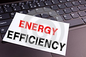 Writing showing Energy Efficiency made in the office with surroundings laptop marker pen. Business concept for Building Technology