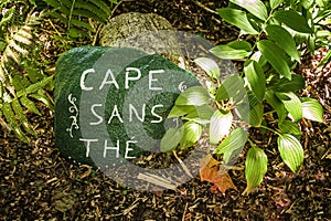 Writing on a stone in front of a historic house in Cap Sante Quebec photo