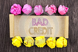 Writing text Bad Credit. Concept meaning Poor Bank Rating Score For Loan Finance written on sticky note paper with folded paper y