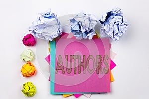 Writing text showing Authors written on sticky note in office with paper balls. Business concept for Word Message Text Typog