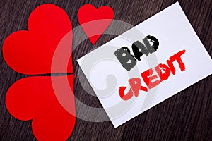 Writing text showing Bad Credit. Concept meaning Poor Bank Rating Score For Loan Finance written on notobook paper note on the wo