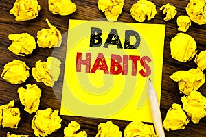 Writing text showing Bad Habits. Business concept for Improvement Break Habitual Hebit Written on sticky note paper, wooden backgr