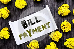 Writing text showing Bill Payment. Business concept for Billing Pay Costs Written on sticky note notepad note notebook book wooden