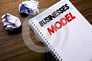 Writing text showing Businesses Model. Business concept for Project For Business written on notebook notepad note paper on the woo