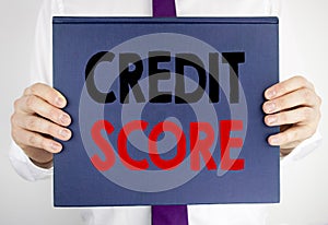 Writing text showing Credit Score. Business concept for Financial Rating Record written on book notebook paper holding by the man