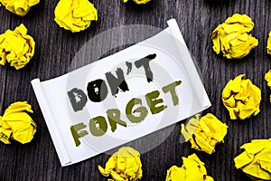 Writing text showing Do Not Forget. Business concept for Don t memory Remider Written on sticky note notepad note notebook book wo