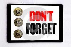 Writing text showing Do Not Forget. Business concept for Don t memory Remider written on tablet screen on the white background wit photo