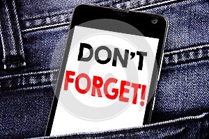 Writing text showing Do Not Forget. Business concept for Reminder Message written mobile cell phone with copy space in the back pa