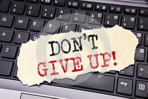 Writing text showing Don t Give Up. Business concept for Motivation Determination, written on sticky note paper on the black keybo