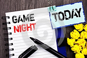 Writing text showing Game Night. Business photo showcasing Entertainment Fun Play Time Event For Gaming written on notebook book