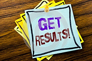 Writing text showing Get Results. Business concept for Achieve Result written on sticky note paper on the wooden background.