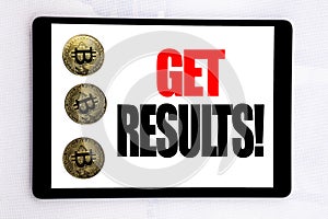 Writing text showing Get Results. Business concept for Achieve Result written on tablet screen on the white background with crypto