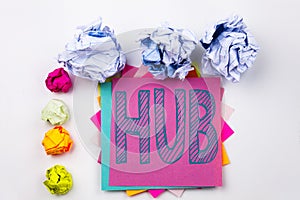 Writing text showing HUB written on sticky note in office with paper balls. Business concept for HUB Advertisement on the wh