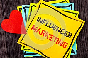 Writing text showing Influancer Marketing. Concept meaning Social Media Online Influence Strategy written on Stikcy Note Paper on
