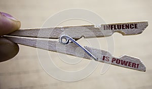 Writing text showing Influence Is Power. Business concept for Persuasion Strategy written on clip close up with blurred background