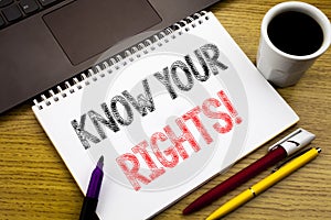 Writing text showing Know Your Rights. Business concept for Justice Education written on notebook book on the wooden background in